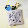 MapTote New Jersey map tote bag with illustrated state map and books inside on light background