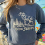 Kanibal & Co. Summit New Jersey sweatshirt with ram and tree graphic worn by woman outdoors