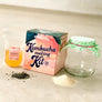 DIY kombucha kit by Farm Steady Brooklyn Brew Shop including glass jar, kombucha starter, tea leaves, and sugar