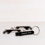Kanibal & Co. black Jersey City bottle opener keychain with white text and metal key ring