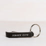 Kanibal & Co. black Jersey City bottle opener keychain with silver split ring for home decor