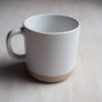 Kanibal Co Jersey City ceramic mug in white with speckled design and beige base