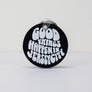 Kanibal & Co. black round Jersey City souvenir keychain with white Good Things Happen In Jersey City text