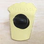 Back view of golden fries enamel pin with black clasp from Kanibal & Co.