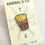 Kanibal & Co golden fries enamel pin with red container and text nothing gold can stay