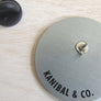 Back view of Kanibal & Co metal backing and pin clutch for otter space enamel pin