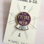 Kanibal & Co future is unclear enamel pin with purple and gold crystal ball design on display card