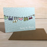 Kanibal & Co encouragement greeting card with hanging clothes and hang in there message