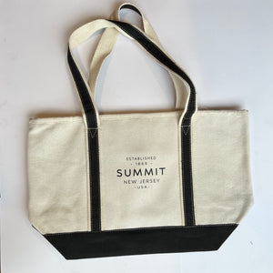 Off white canvas tote bag with black handles and bottom.  Text on bag "Established 1869 Summit New Jersey USA"