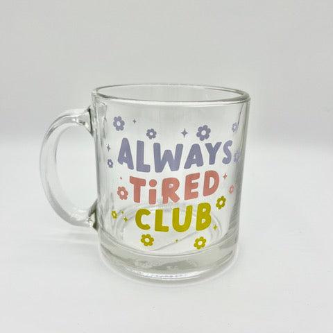 glass mug that reads Always Tired Club.