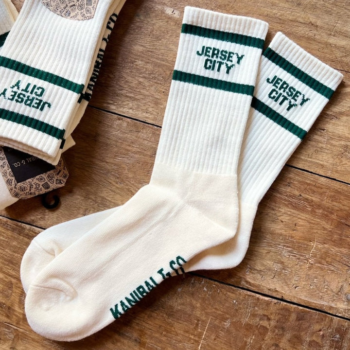 Two pairs of socks that read Jersey City
