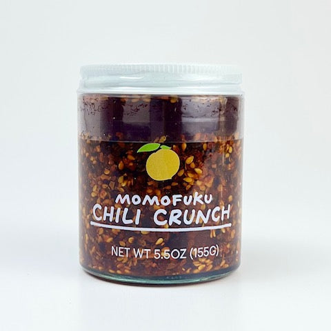 Jar of Momofuku Chili Crunch on a white background
