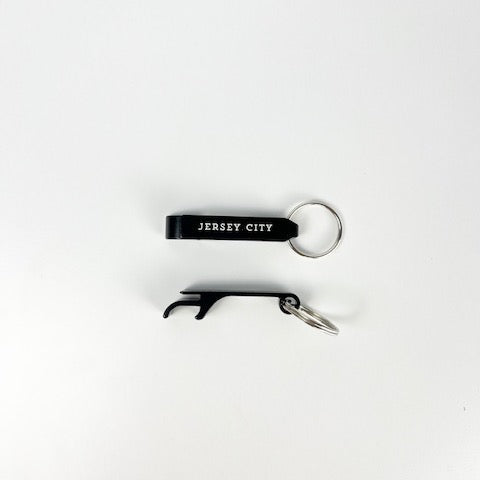 Keychain with bottle opener and 'Jersey City' text on a white background
