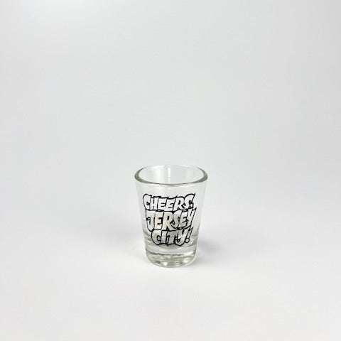 Clear shot glass with 'Cheers Jersey City!' text on a white background