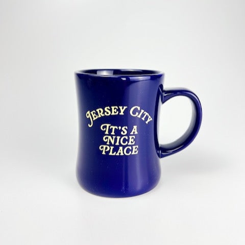 Blue mug with 'Jersey City It's a Nice Place' text on a white background