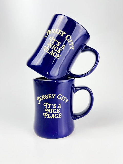 Two blue mugs with 'Jersey City It's a Nice Place' text on a white background