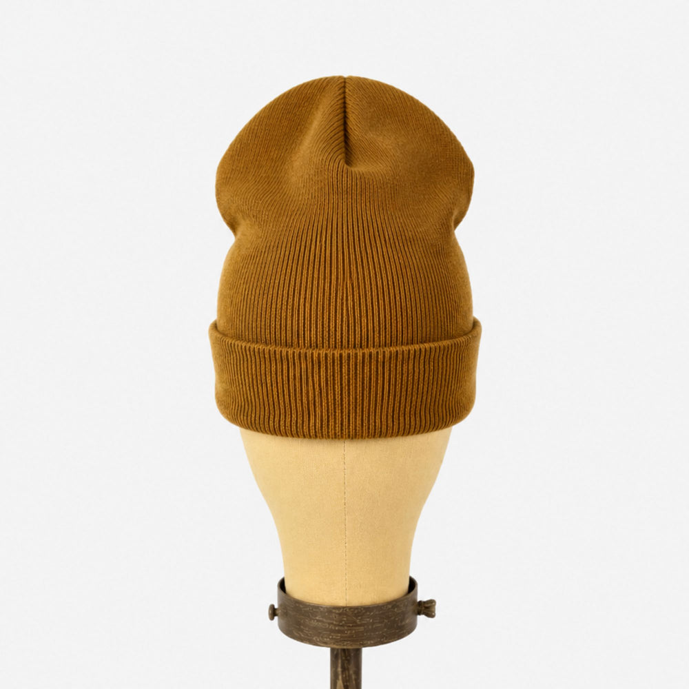 Brown beanie on a mannequin head against a white background