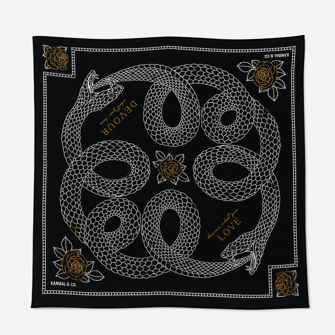 Black bandana with white and gold snake design on a white background