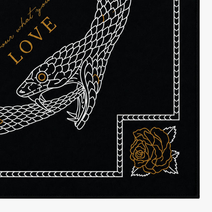 Decorative design with a snake and rose on a black background