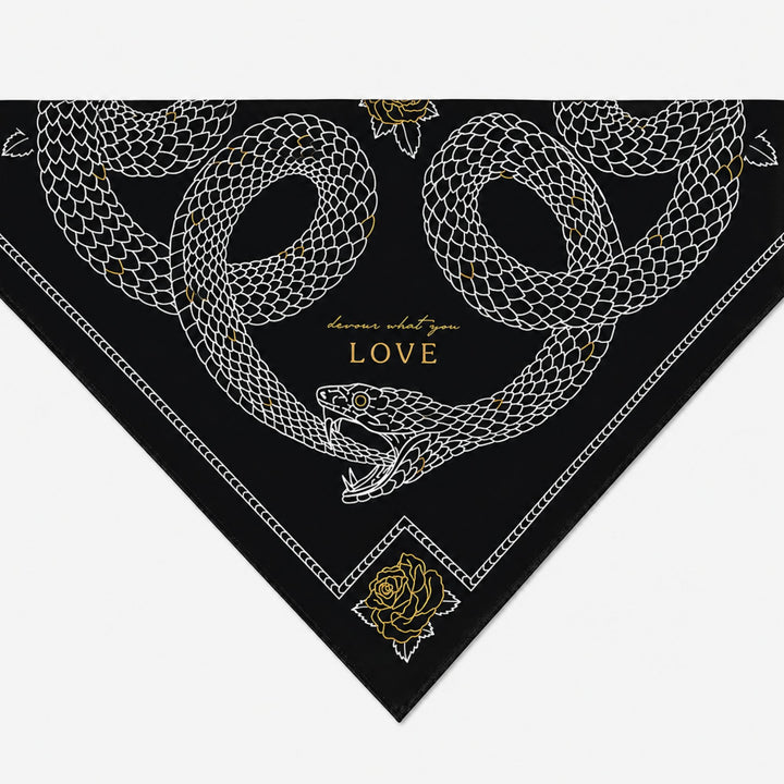 Black bandana with white snake design and gold text on a white background