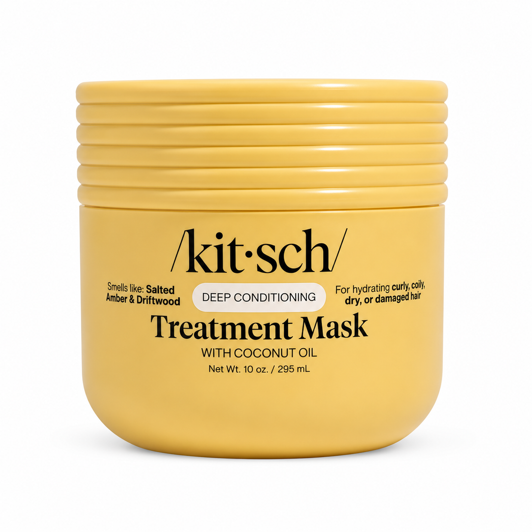 A yellow plastic jar of kit-sch Treatment Mask with Coconut Oil, Deep Conditioning, on a white background.