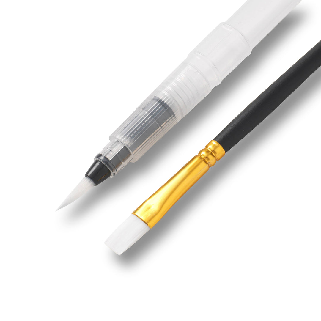 A watercolor brush with a clear barrel and fine white tip shown alongside a smaller paintbrush with a black handle, gold ferrule, and white bristles on a white background.