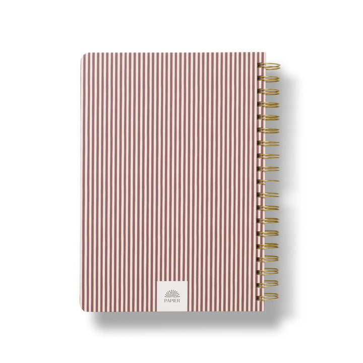 B5 hardcover spiral notebook in pink and white stripes with a gold spiral binding