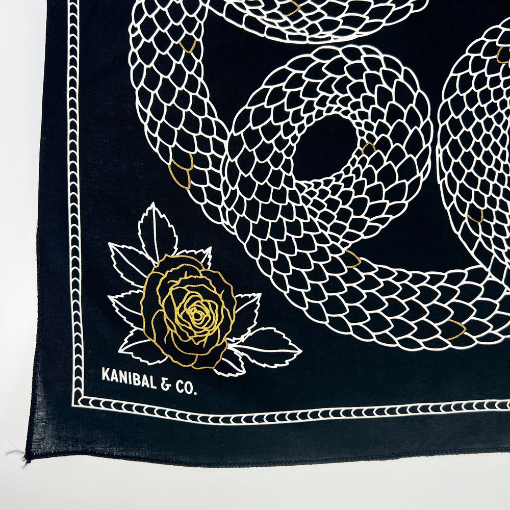 Kanibal & Co. Bandana: Devour Snake featuring artistic snake and rose design on a black background