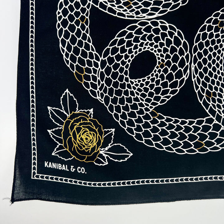 Kanibal & Co. Bandana: Devour Snake featuring artistic snake and rose design on a black background