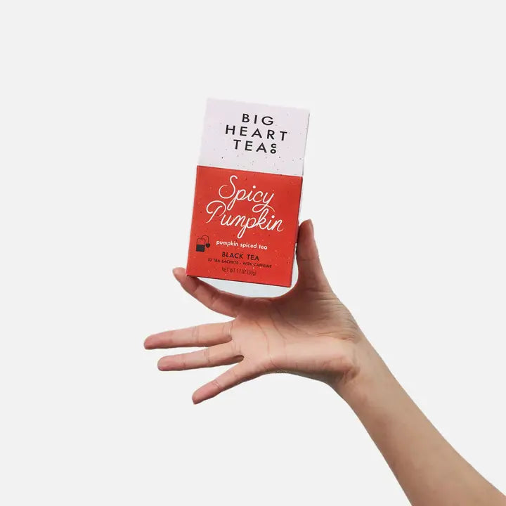 Big Heart Tea Co. Spicy Pumpkin Tea in a stylish box held by a hand, featuring pumpkin spice flavors