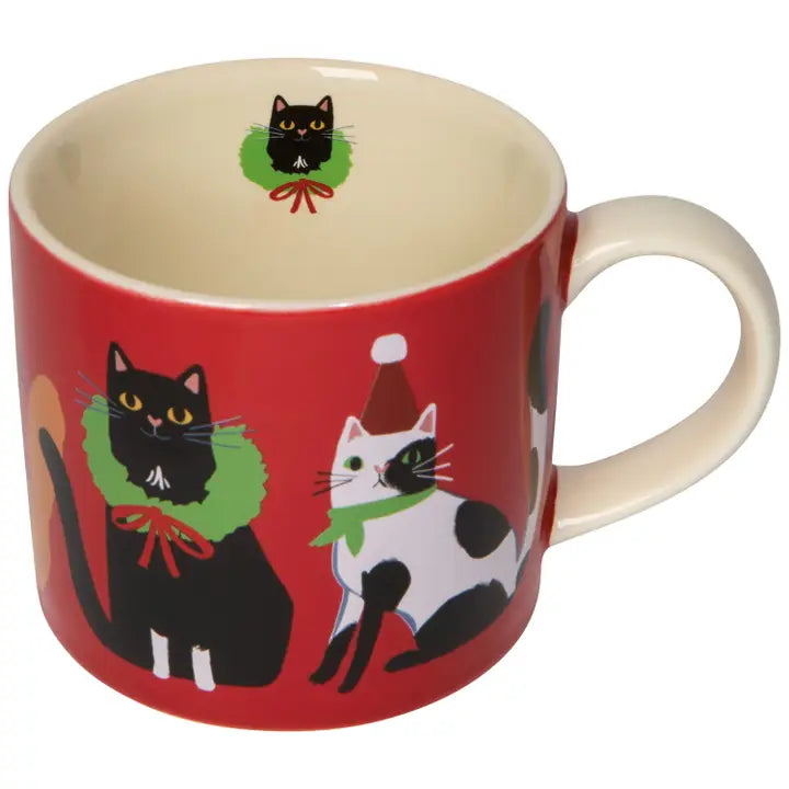 Danica cat Christmas mug featuring festive black and white cats in holiday wreaths and Santa hats