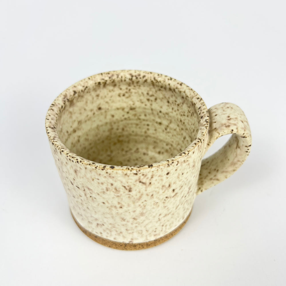 Natural ceramic speckle mug from Jordan B Ceramics with a textured exterior and a sturdy handle