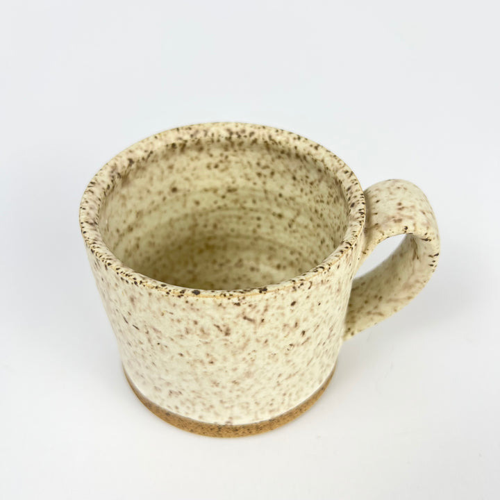 Natural ceramic speckle mug from Jordan B Ceramics with a textured exterior and a sturdy handle