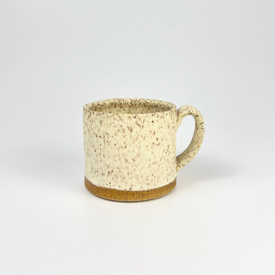Handcrafted Jordan B ceramic speckle mug with a rustic design and earthy tones