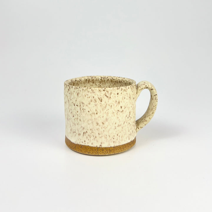 Handcrafted Jordan B ceramic speckle mug with a rustic design and earthy tones