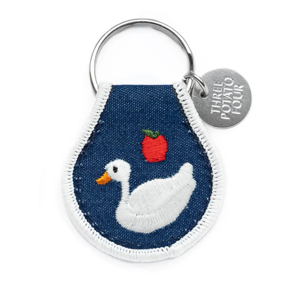 Cottage goose patch keychain featuring an embroidered goose and apple design by Three Potato Four