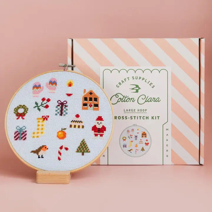 Cotton Clara cross stitch hoop showing Santa tree gifts and ornaments with striped box Craft kit Christmas