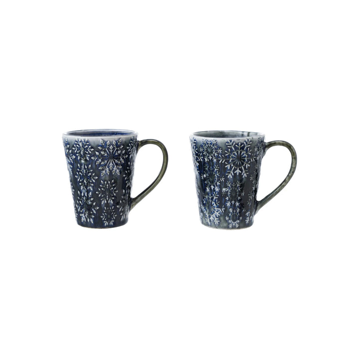 Set of two blue debossed ceramic mugs with intricate floral patterns for stylish beverage enjoyment