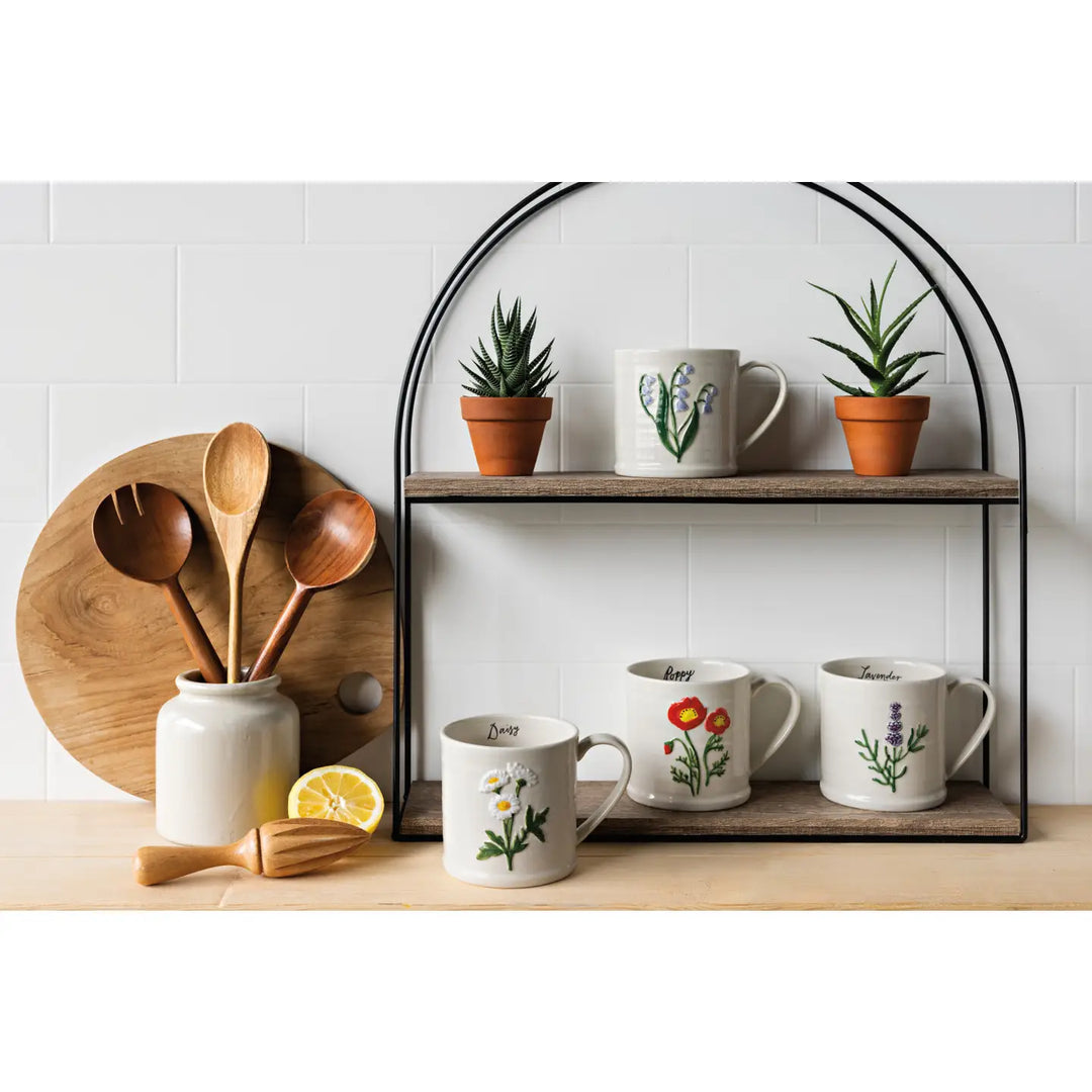 Display of Danica embossed bluebell mug with decorative plants and wooden kitchen utensils