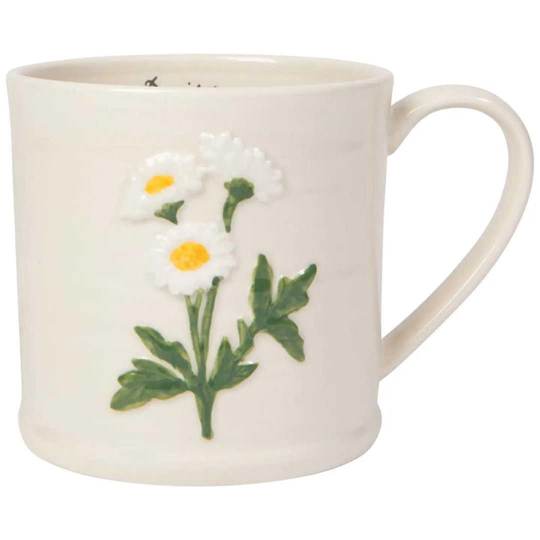 Danica embossed daisy mug featuring a charming daisy design on a cream background