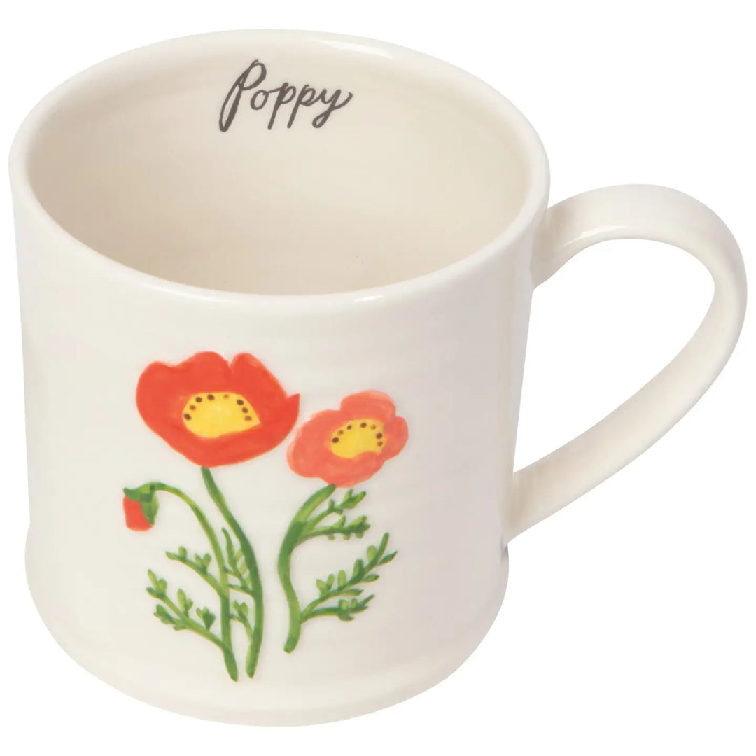 Danica embossed poppy mug featuring colorful poppy flower design on a white background