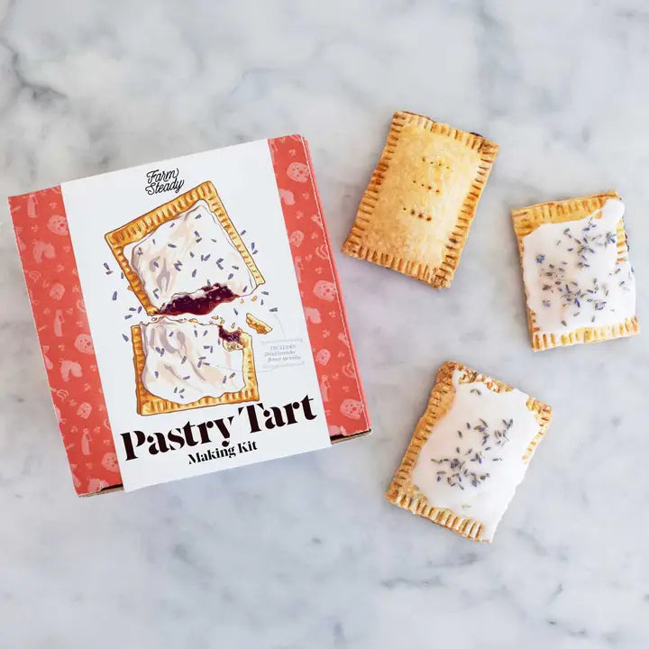 Farm Steady Pastry Tart DIY Kit with completed tarts featuring icing and lavender on a marble background