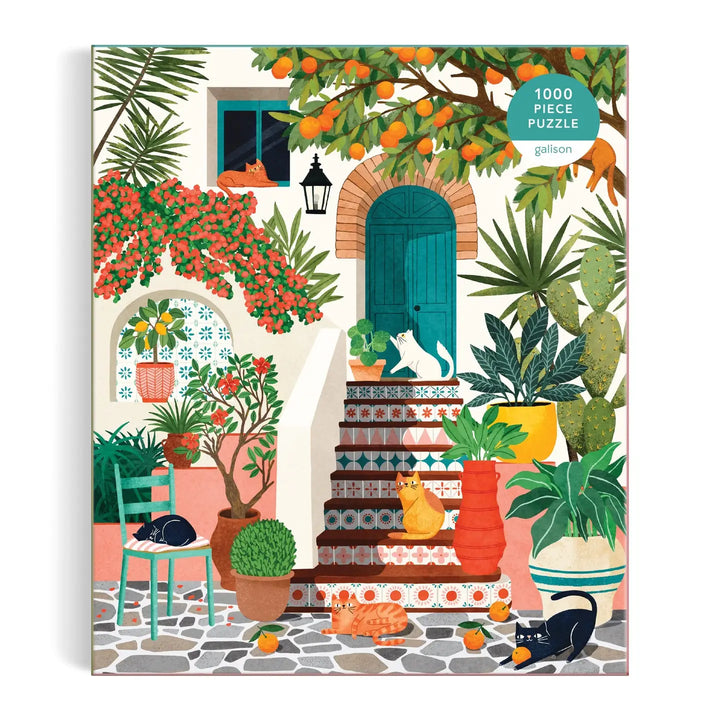 Mediterranean cats puzzle featuring colorful artwork of cats and vibrant plant life in a sunny courtyard
