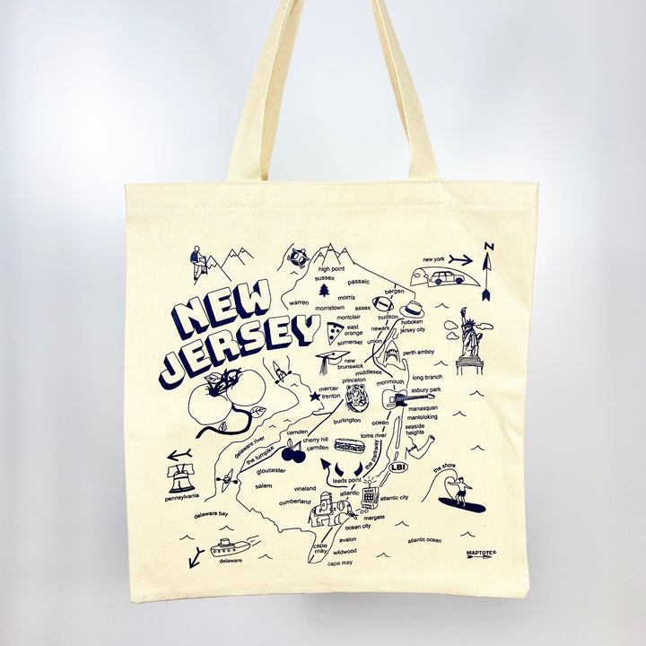 MapTote New Jersey map tote bag cream canvas with navy hand drawn state map showing landmarks