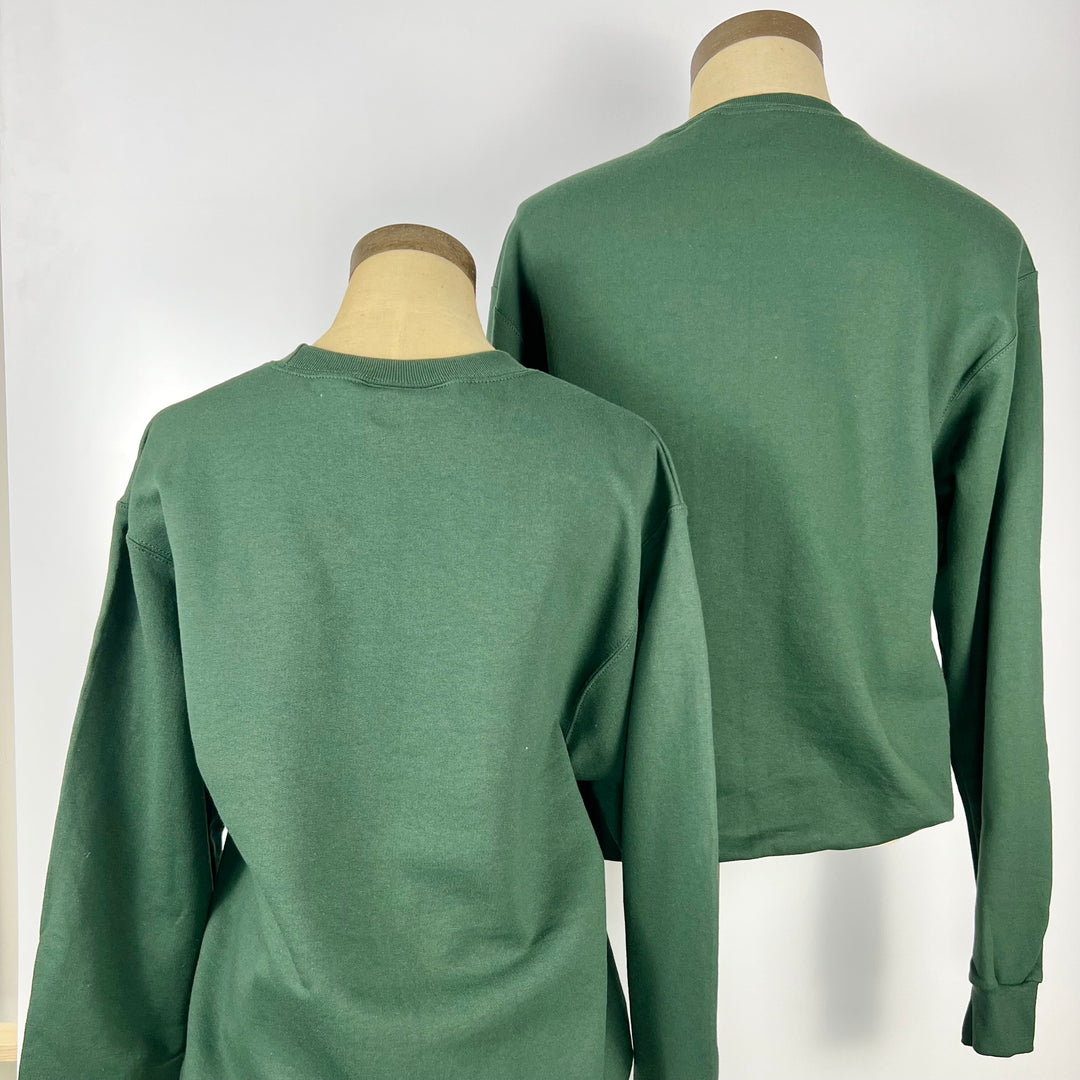 Back view of two green Garden State sweatshirts displayed on mannequins by Kanibal & Co