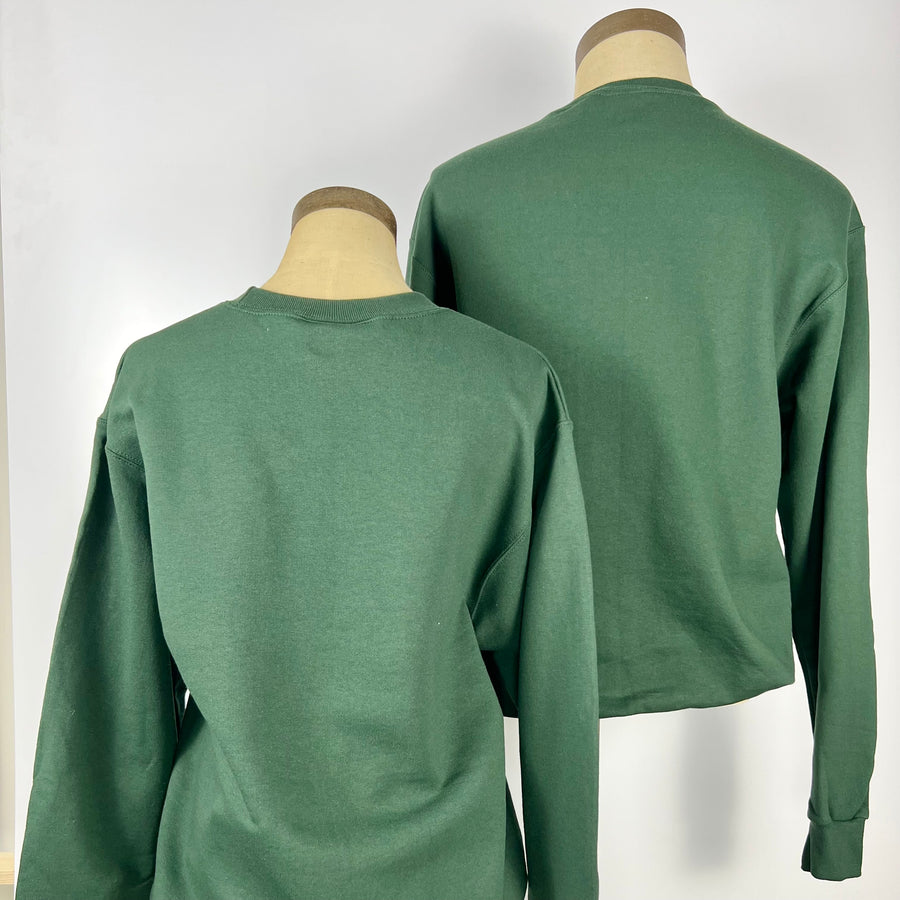 Back view of two green Garden State sweatshirts displayed on mannequins by Kanibal & Co