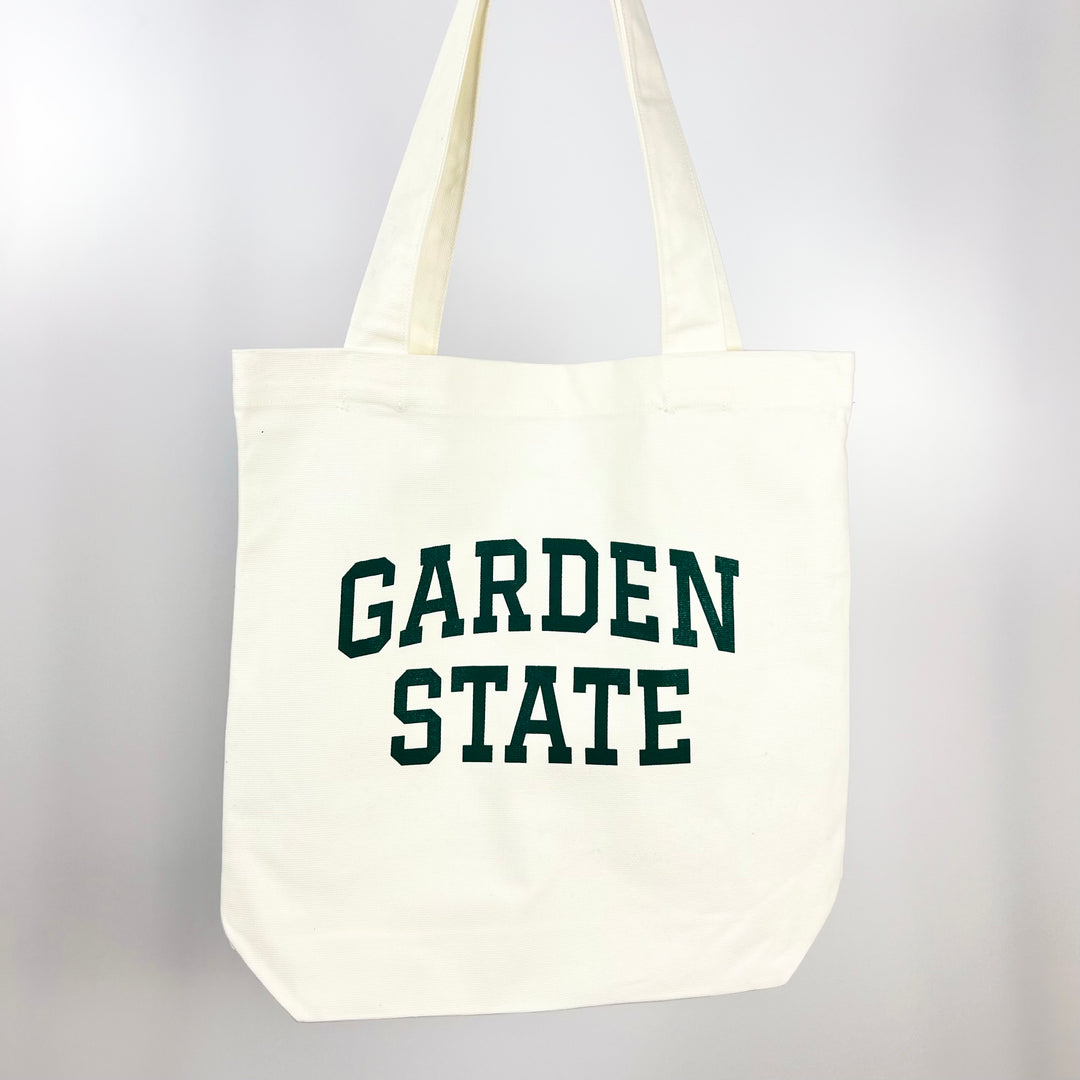 Kanibal Co. Garden State tote bag in white with green block lettering and sturdy handles