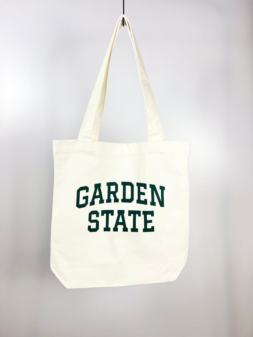 Kanibal & Co Garden State tote bag in white canvas with green text and long handles