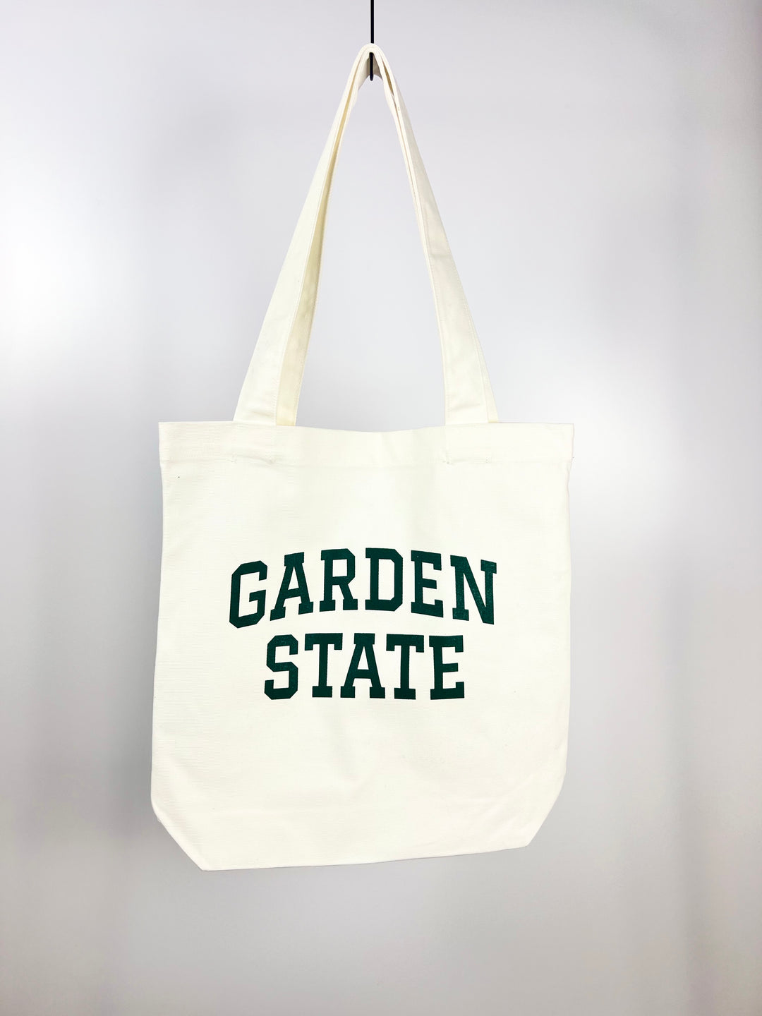 Kanibal & Co Garden State tote bag in white canvas with green text and long handles