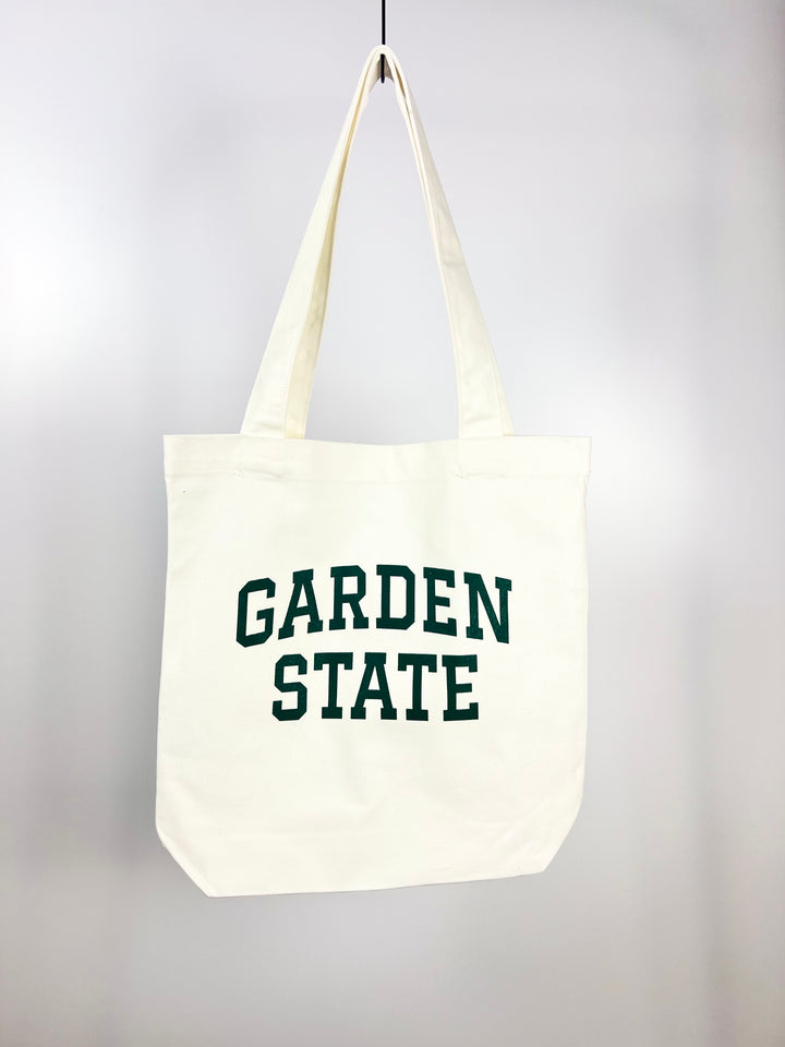 Kanibal & Co Garden State tote bag in white canvas with green text and long handles
